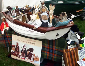 The Sally Jane Miniatures stand at Blenheim, with the Collectable Friends sitting in a wooden boat